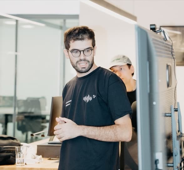 Someone talking a piece of work through with two colleagues