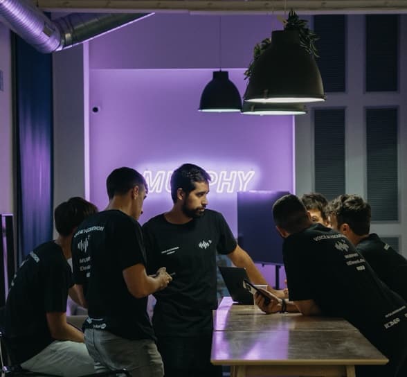 The team together in the office in the evening